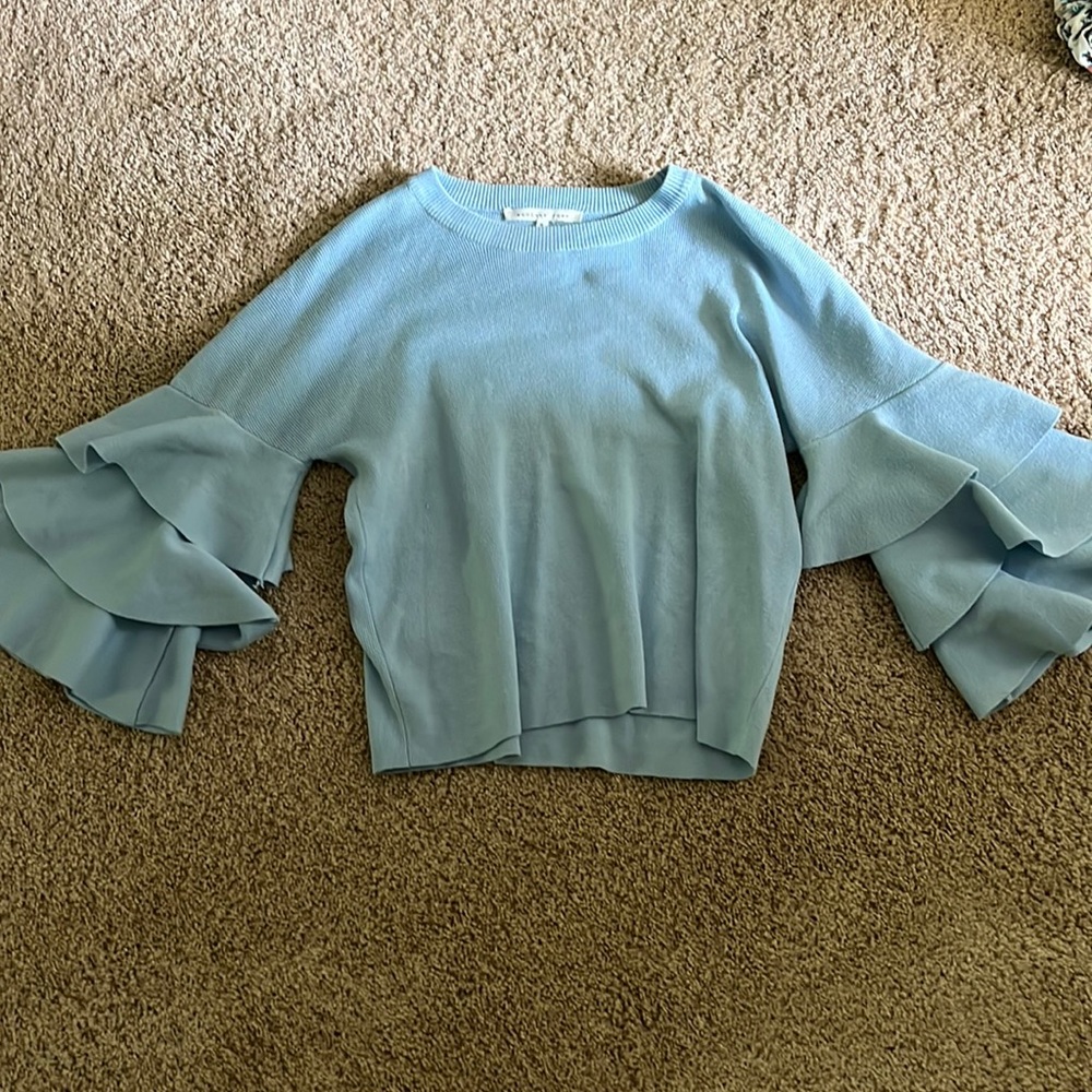 Cute light blue sweater with ruffle sleeves